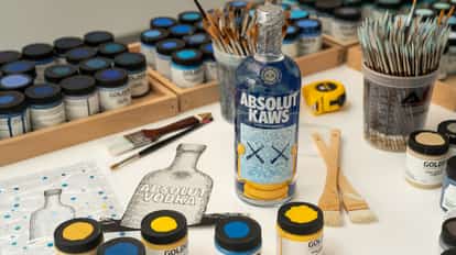 Absolut KAWS bottle on KAWS work table with paints