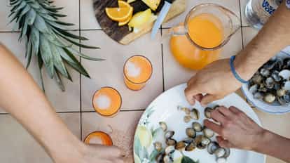Drinks and snacks with hands reaching for the snacks