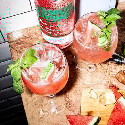 Watermelon Spritz next to a bottle of Absolut Watermelon.